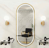 Golden frame oval mirror